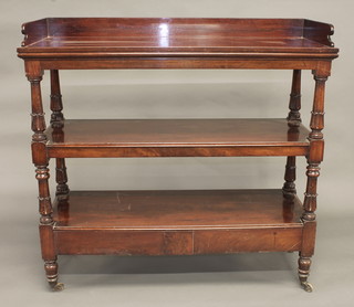 A William IV mahogany 3 tier buffet with three-quarter gallery, the base fitted 2 drawers, raised on turned supports 48"