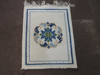 A white ground and floral patterned Chinese rug 35" x 25"