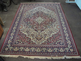 A red ground machine made Persian style carpet with central medallion 136" x 99"