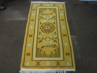 A yellow ground Chinese rug 71" x 37"
