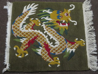 A green ground Chinese rug decorated a dragon 25" x 25"
