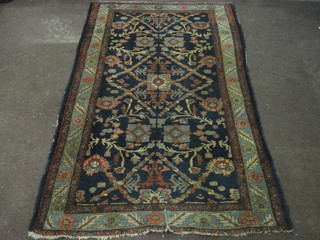 A blue ground Persian rug with floral design 81" x 48"
