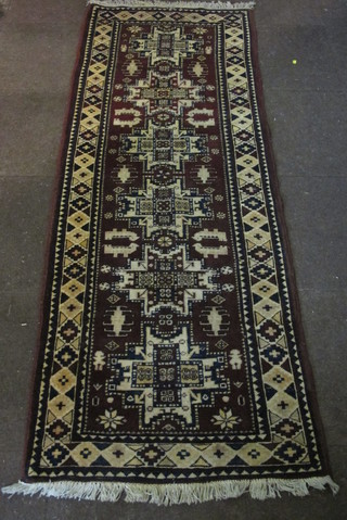 A brown ground Eastern rug with 6 octagons to the centre within  multi row borders 88" x 132"