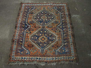 A Caucasian rug with 2 diamonds to the centre 59" x 47"