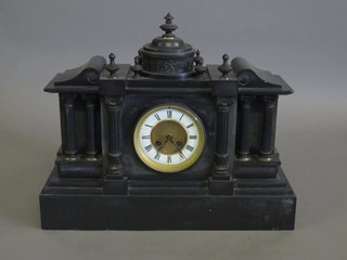 A Victorian 8 day striking mantel clock contained in a black marble architectural case with enamelled dial and Roman  numerals