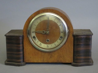 An aneroid barometer with silvered dial contained in a brown Bakelite case