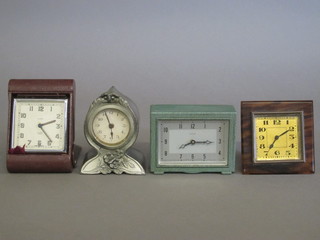 A Smiths alarm clock, an Enfield mantel clock with rectangular silvered dial, a travelling clock contained in a simulated  tortoiseshell case and 1 other small clock