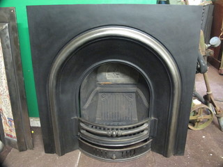 A reproduction Victorian cast iron fire place insert 38"
