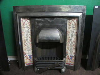 A Victorian style polished steel and tiled fire place insert 38"