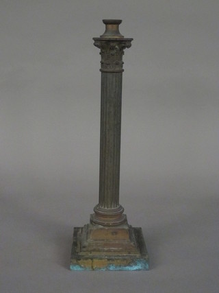 A 19th Century gilt metal oil lamp base in the form of a reeded Corinthian column, raised on a stepped base 18"