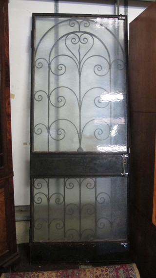 A wrought iron door grill 77" x 30"