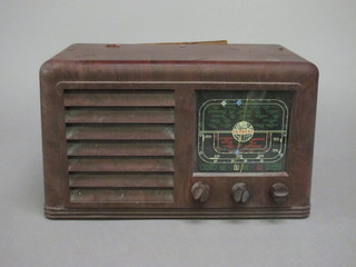 A Derwent portable radio contained in a brown Bakelite case