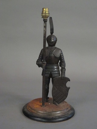 A metal table lamp in the form of a standing Knight 14"