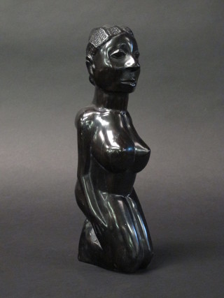 An African polished and carved hardwood figure of a kneeling  lady 12"