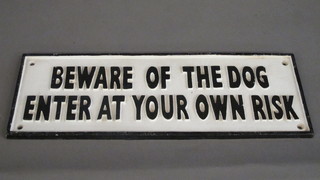 A cast iron sign marked Beware of Dog Enter at Your Own Risk  5 1/2" x 15 1/2"