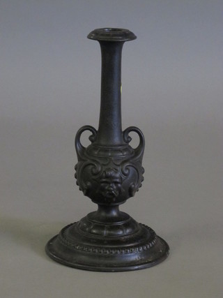 An Art Nouveau bronze candlestick 10"