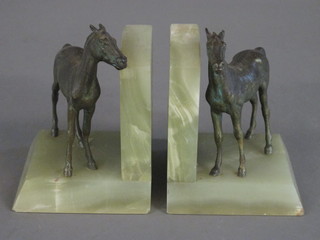A pair of green marble and metal book ends in the form of  standing horses 5"