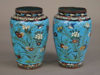 A pair of blue ground cloisonne vases with floral decoration