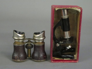 A student's single pillar microscope and a pair of opera glasses