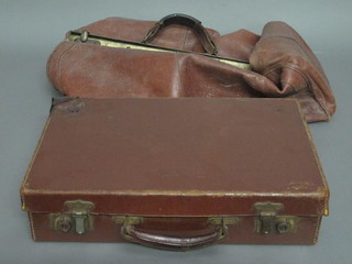 A leather attache case and a leather Gladstone bag