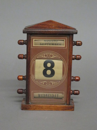 A Victorian perpetual calendar contained in a mahogany case   ILLUSTRATED