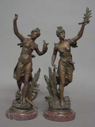 A pair of Continental spelter figures in the form of standing  ladies 15"