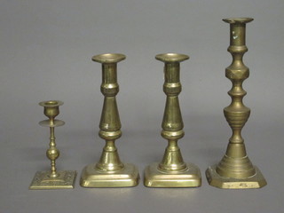 A pair of 19th Century brass candlesticks with ejectors 8 1/2"  and 1 other