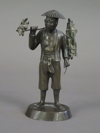 A bronze figure of a standing gentleman 9 1/2"