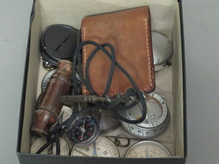 A collection of compasses and a cork screw