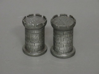 A pair of Bovril pewter advertising pepperettes in the form of castelated towers