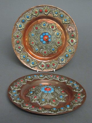 A pair of circular Eastern copper and embossed gilt metal polished hardstone studded chargers 8 1/2"   ILLUSTRATED