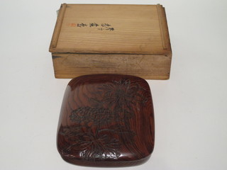 A carved Japanese hardwood box, signed 9"