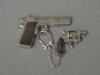 A Spanish model lighter in the form of an automatic pistol and 1 other in the form of a revolver