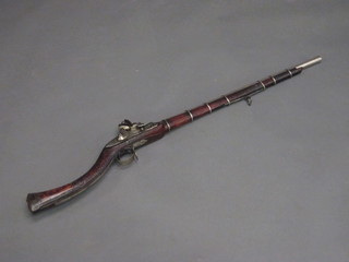 A 19th Century native flintlock giselle with 29 1/2" octagonal barrel  ILLUSTRATED