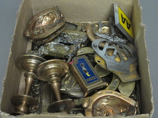 2 AA car badges, a pair of brass candlesticks and a small  collection of brass badges