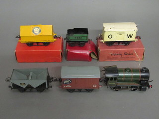 A Hornby O gauge type 51 clockwork locomotive, a Hornby  cement wagon, a Hornby A Bestiaux wagon no.1, a Hornby  no.1 refrigeration wagon, a Tremie wagon and a Hornby no. 1  Heurtoir wagon