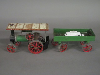 A Mamod steam engine and trailer, some rust,