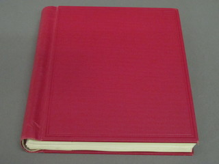A red Senator stamp album containing a collection of mid 1950's Commonwealth stamps