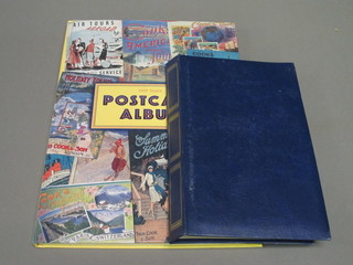 A Past Times album containing a collection of postcards and a  blue album of postcards