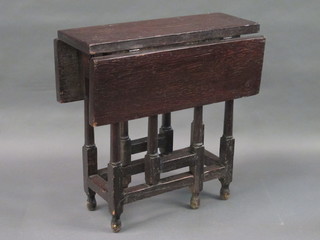 An 18th/19th Century rectangular elm tea table raised on turned supports 28"