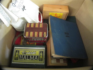 A box of various board games, draughts etc