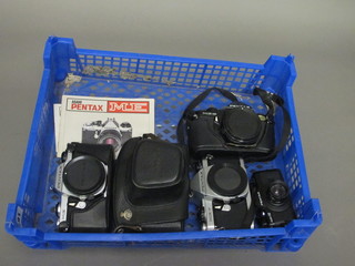 A Pentax ME Super, a Pentax MEF, a Pentax Ashi 1.8/55 lens  and a Pentax 110