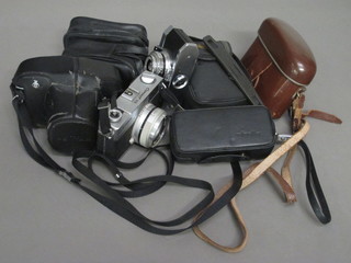 A Pentax ME Super camera with SCM Pentax - M1:1.7 lens, a  Canon coronet 28, 4 other cameras, a pair of binoculars and a flash unit