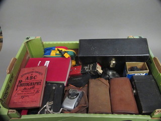 A Bell & Howson auto load camera, 5 box cameras and other photographic equipment