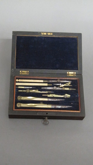 A set of 19th Century geometry instruments contained in a  rosewood case with hinged lid
