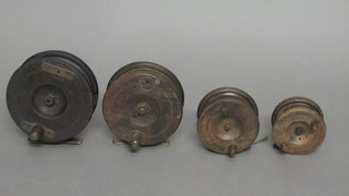 2 centre pin star back fishing reels 5", 2 other wooden fishing reels 3" and 3 1/2"