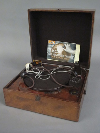 A His Master's Voice electric record player contained in a  mahogany case