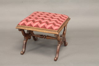 A 19th Century rectangular mahogany stool raised on X framed supports with drop in seat 21"