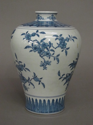 An Oriental blue and white vase decorated birds amidst branches 14"