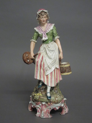 A Continental porcelain figure of a standing milkmaid 15", f,